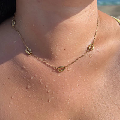16-inch dainty chain necklace with mini cowrie shell charms, perfect for layering and summer looks.