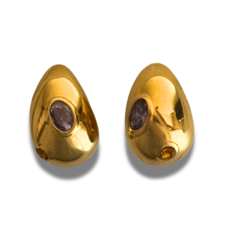 Pair of gold earrings with embedded stones on a white background.Medium 18k gold-filled oval stud with purple and orange gemstones; hypoallergenic posts; polished fall color pop. 
