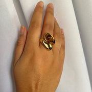 A stunning yin-yang inspired design. The Harmony Dual Gem Adjustable Ring features a beautiful contrast between a white synthetic pearl and a brown tortoise-style resin gemstone. Adjustable from sizes 7–9 and crafted with 18k gold-filled materials, this ring is waterproof, tarnish-free, and the perfect blend of balance and beauty.