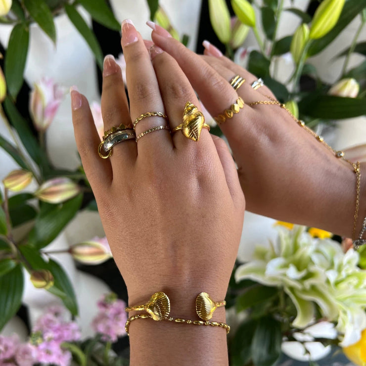 Bold adjustable ring with a large shell design, made of 18k gold-filled, tarnish-free and waterproof.