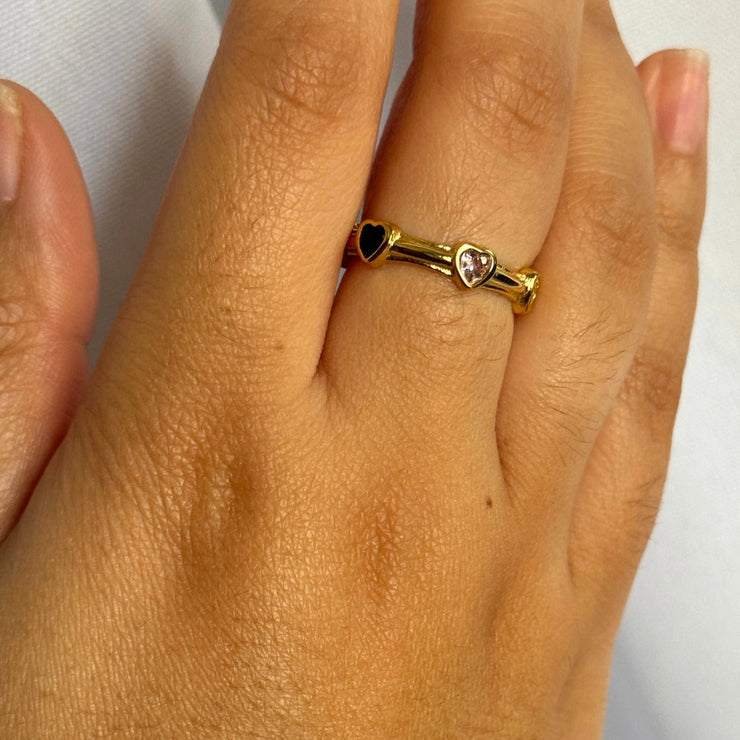 Colorful, cute, and full of personality — the Candy Hearts Adjustable Ring features a row of tiny multi-color hearts set on an 18k gold-filled band. Adjustable from sizes 6–8, this ring is the sweetest way to add a playful pop of color to your ring stack. Tarnish-free, waterproof, and made for everyday joy.