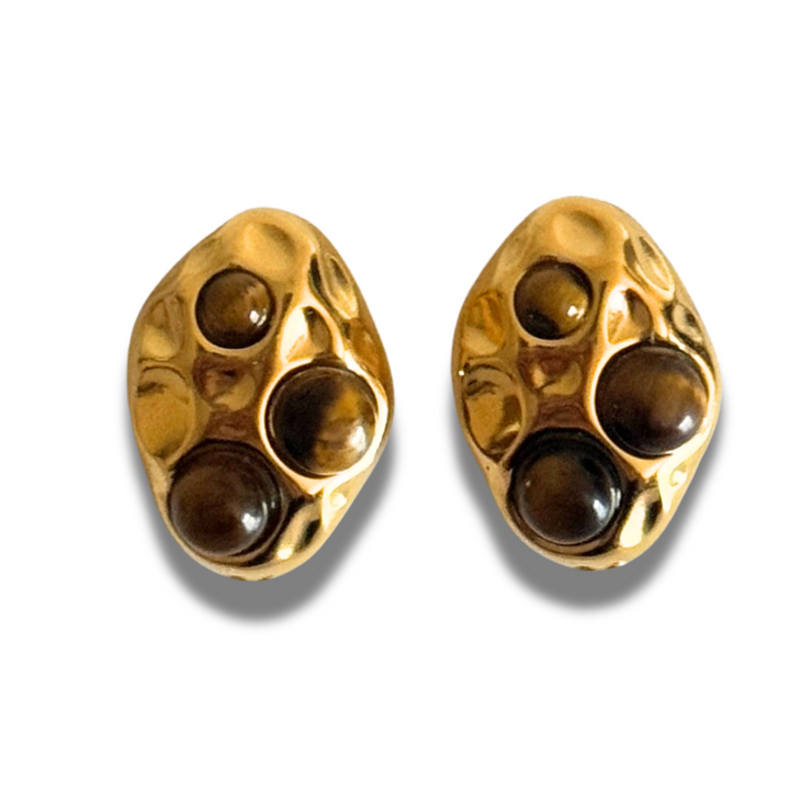 Pair of gold earrings with brown gemstones on a white background.Textured gold stud with Tiger’s Eye accents set in multiple spots; hypoallergenic, tarnish-free neutral fall stud.