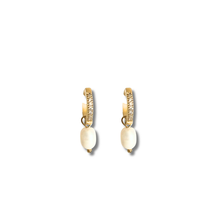 Gold crystal huggie earring with freshwater pearl drop, perfect for sensitive ears.Crafted in 18K gold-filled material, this earring is hypoallergenic, tarnish-free, and perfect for sensitive skin. A lightweight everyday luxury that adds a touch of ocean elegance to any outfit.