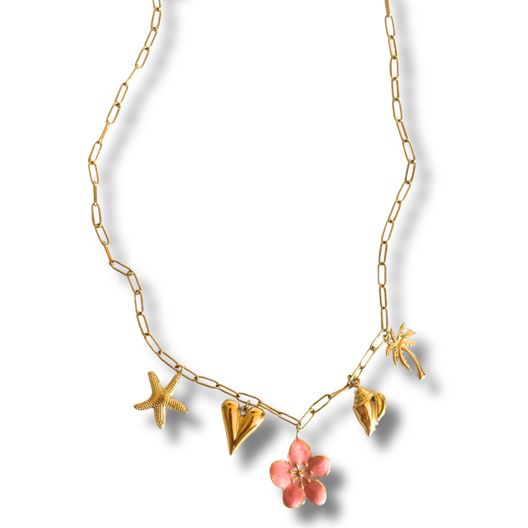 Gold necklace with starfish, heart, and flower charms on a white background. tropical charm necklace, hibiscus necklace, summer gold necklace, vacation jewelry, beachy charm necklace

Tropical Escape Hibiscus Charm Necklace

Pink Flower Beach Charm Necklace

Gold tropical charm necklace with pink flower, heart, seashell, starfish, and palm tree

Summer vacation necklace with hibiscus-inspired design