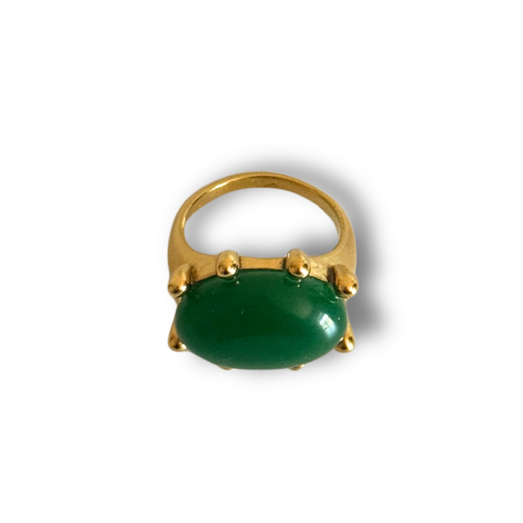 Gold ring with a green gemstone on a white background. Green gemstone statement ring in 18k gold-filled finish; size 7 only; tarnish-free and waterproof for daily wear
