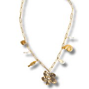 Gold necklace with floral pendants on a white background. Tarnish-free and hypoallergenic, it’s made for sensitive skin and everyday wear.

mixed metal charm necklace, floral pearl necklace, coastal necklace, seashell charm necklace, beach jewelry

Mixed Metal Flower and Pearl Charm Necklace

Coastal Bloom Gold and Silver Necklace

Mixed metal necklace with floral centerpiece, faux pearls, heart, and seashell charms

Gold and silver charm necklace