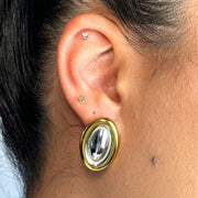 With a sleek gold outline and a silver inner glow, the Nova Oval Stud brings that trending energy in the most timeless way. It’s minimal, sculptural, and a total must for your ear stack rotation.