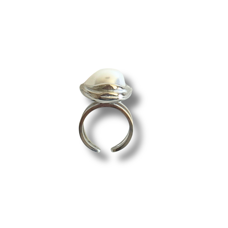 Silver ring with a central pearl on a white background.Hypoallergenic and waterproof, this ring is your go-to for everyday glam—no need to take it off when you wash your hands or dive into your summer adventures.
