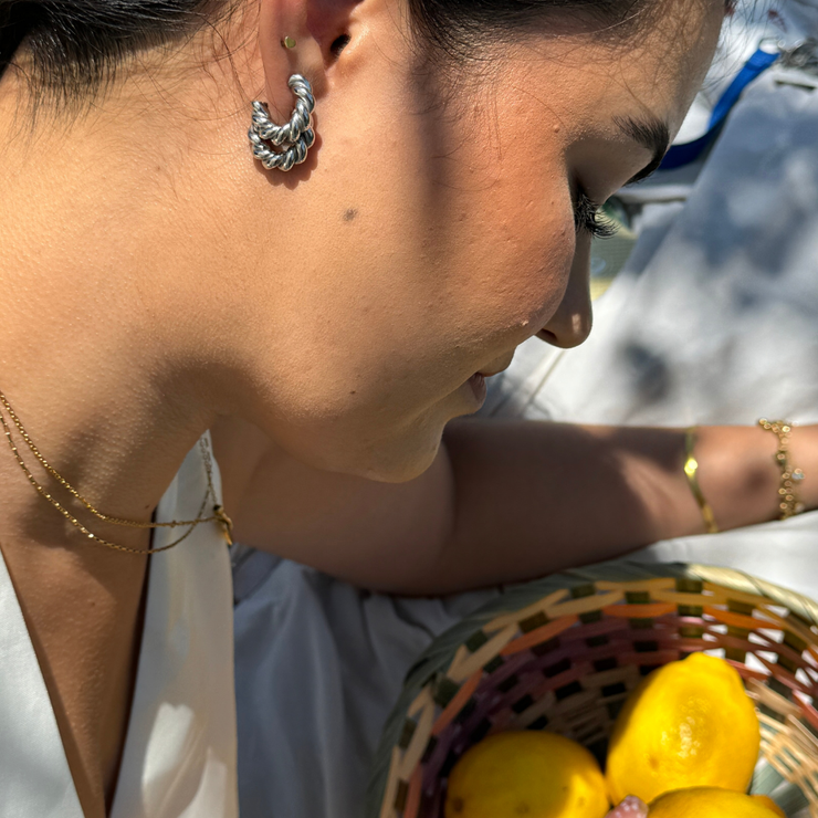 sterling silver twisted hoops that are hypoallergenic and tarnish free water resistant