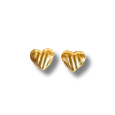 Gold heart-shaped earrings on a white background. 18K gold-filled material, these studs are lightweight, tarnish-free, and gentle on sensitive skin – a must-have everyday piece with a little personality.
Textured gold heart stud earrings with bubble design, hypoallergenic and lightweight