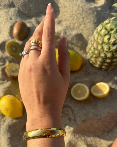 The Clásica Cuff is your go-to everyday bold gold cuff. With its thick band and timeless design, it layers beautifully or makes a sleek solo statement. Made from 18k gold-plated material that’s waterproof and tarnish-free. Adjustable to fit small to large wrists.