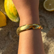 The Clásica Cuff is your go-to everyday bold gold cuff. With its thick band and timeless design, it layers beautifully or makes a sleek solo statement. Made from 18k gold-plated material that’s waterproof and tarnish-free. Adjustable to fit small to large wrists.