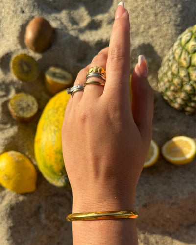 The Triángulo Cuff is a delicate, minimalist cuff with a triangle-shaped point at the center. Lightweight yet striking, it’s the perfect balance of symmetry and style. Adjustable, tarnish-free, and waterproof — made to last and layer.