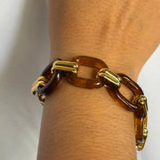 Brown tortoise resin link bracelet with gold textured connectors and tangle clasp, 18k gold-filled hypoallergenic tarnish-free statement bracelet.