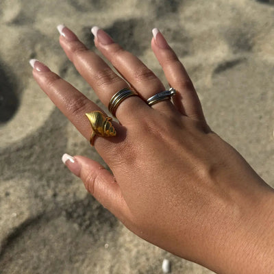 Bold adjustable ring with a large shell design, made of 18k gold-filled, tarnish-free and waterproof.