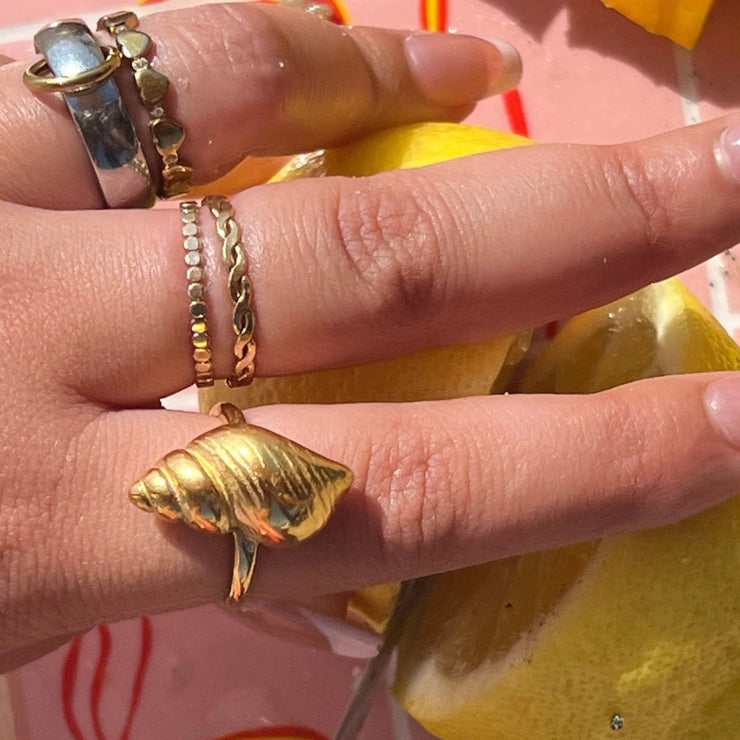 Bold adjustable ring with a large shell design, made of 18k gold-filled, tarnish-free and waterproof.