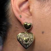 Unique heart locket dangle earring that opens to hold a small photo, hypoallergenic and tarnish-free, perfect for sentimental keepsakes.