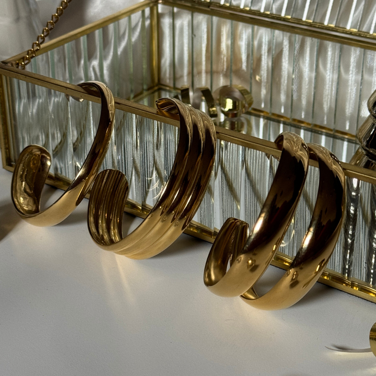 Close-up of adjustable 18k gold-filled double cuff bracelet on wrist, showcasing its shiny, sleek design and trendy layered look tarnish free, water proof