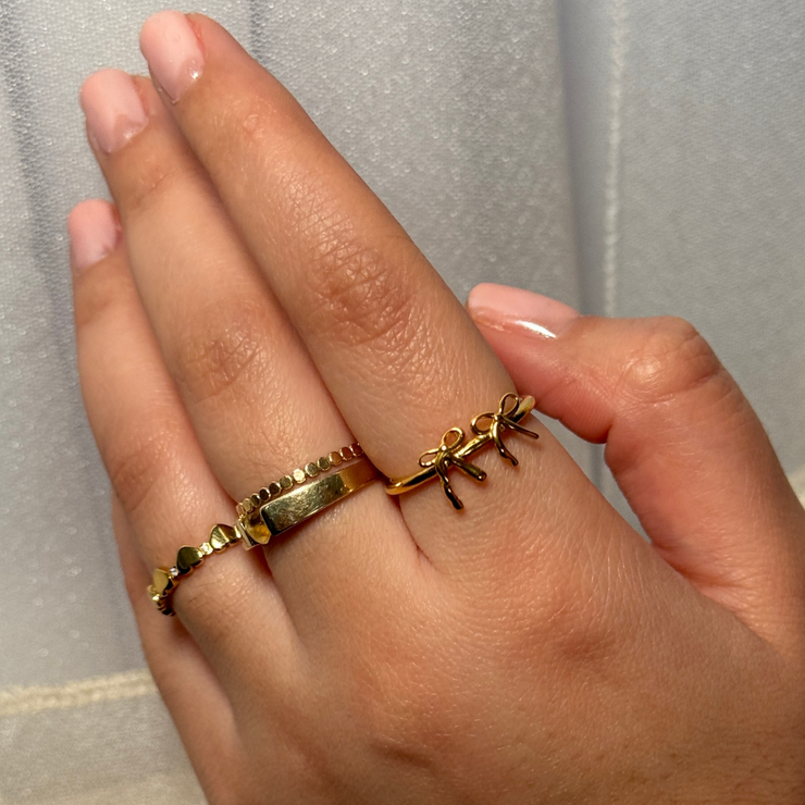 Delicate bow ring with a graceful, feminine design.Gold Filled Hypoallergenic, tarnish-free, and perfect for stacking or wearing alone. Available in sizes 6, 7, 8, and 9.