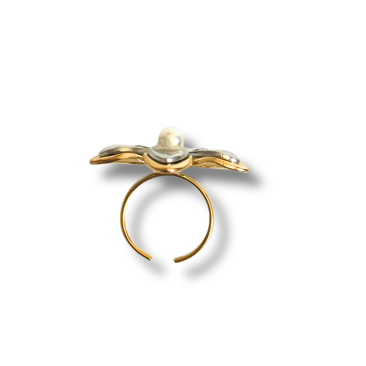 Gold ring with a pearl on a white background. adjustable floral pearl ring, gold pearl flower ring, mixed metal ring, summer jewelry, waterproof ring, hypoallergenic ring, tarnish-free jewelry, statement floral ring. Gold Floral Ring with Pearl Center – Adjustable, Waterproof, Tarnish-Free

Mixed Metal Flower Ring – Silver & Gold with Pearl Center

Blooming Pearl Floral Ring – Gold

Blooming Pearl Floral Ring – Mixed Metal
