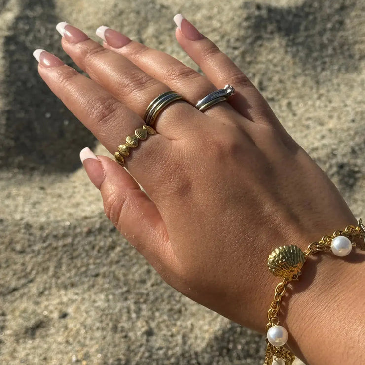 Adjustable 18k gold-filled ring with small sea shells, waterproof and tarnish-free.