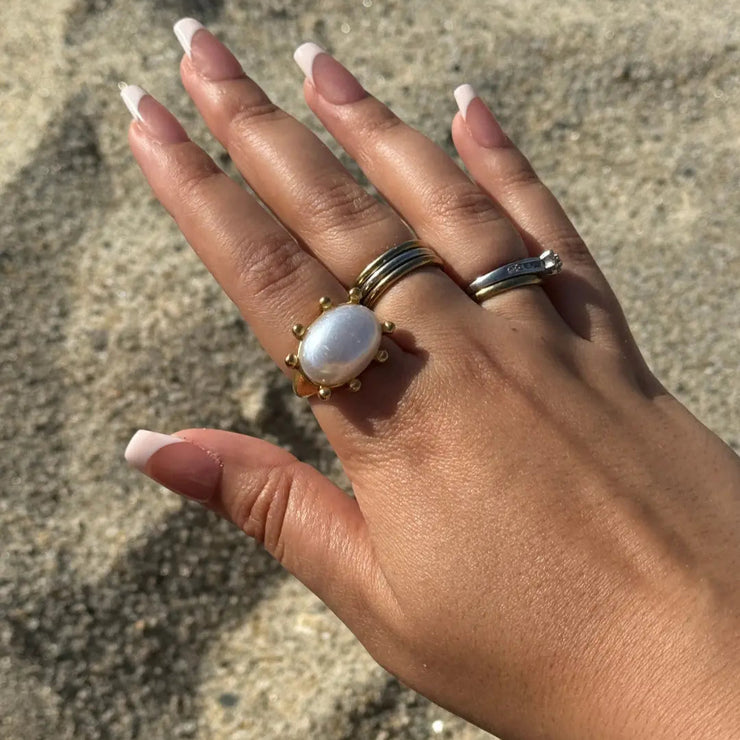 Statement gold ring with a synthetic pearl, 18k gold-filled, waterproof and tarnish-free.

